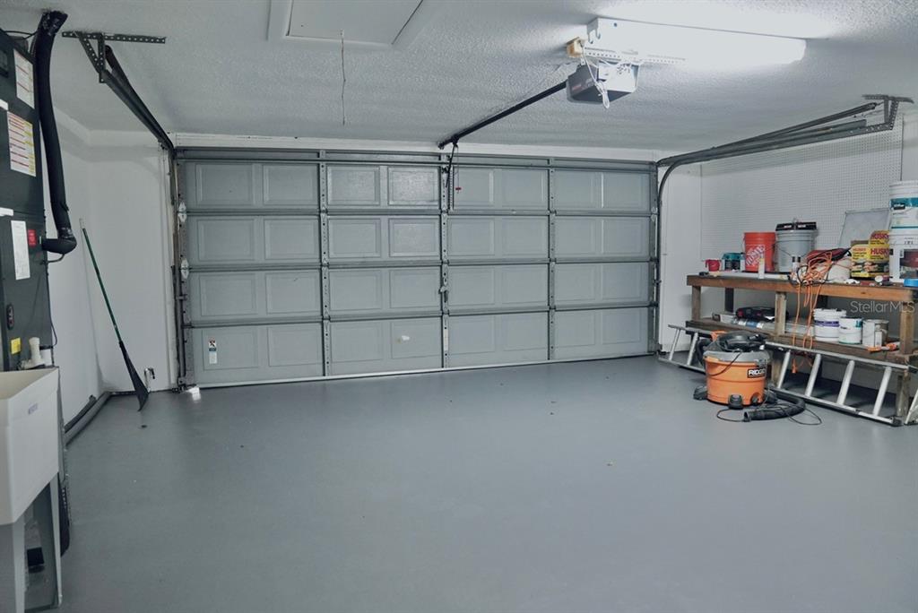 7944 Yucca Drive New Port Richey, FL 34653 - Photo 25 of 26 a view of a storage & utility room with racks on the wall