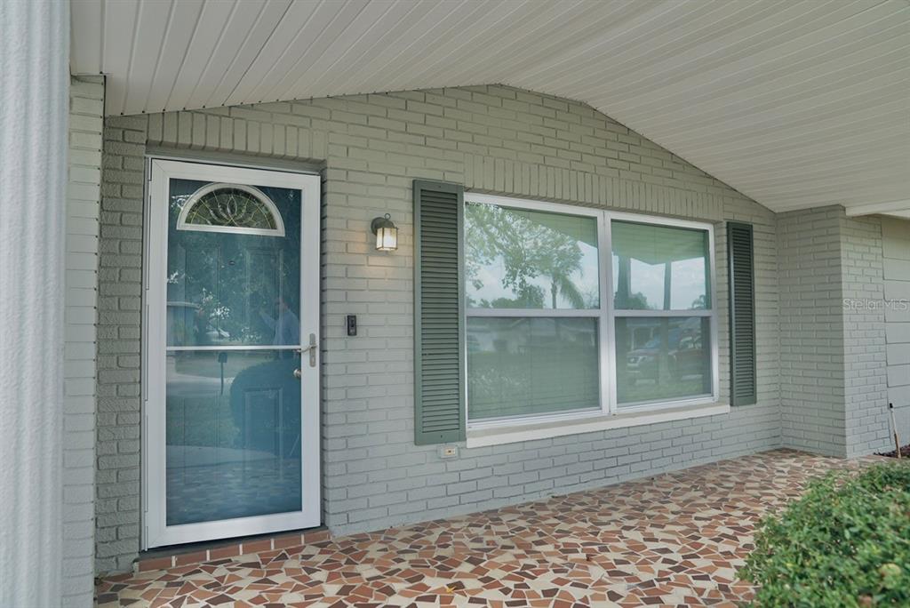 7944 Yucca Drive New Port Richey, FL 34653 - Photo 3 of 26 a view of a door of a house with a yard