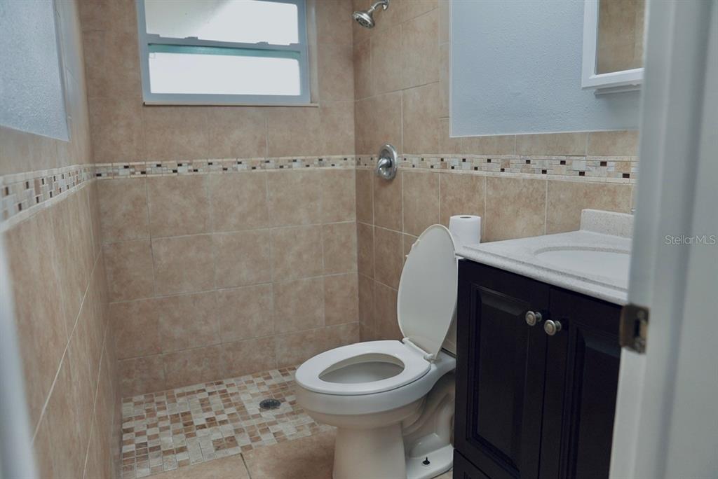 7944 Yucca Drive New Port Richey, FL 34653 - Photo 9 of 26 a bathroom with a sink and a toilet