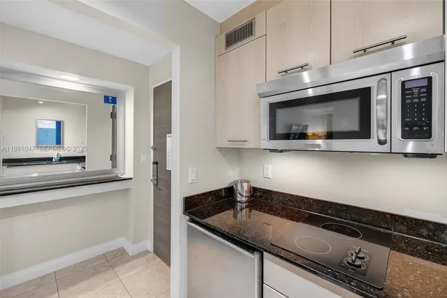 a bedroom with two beds and a night stand