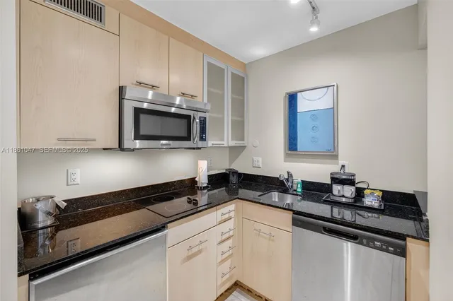 a bedroom with two beds and a window