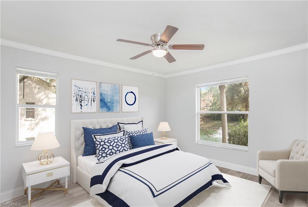 209 Robin Hood Circle, Unit 5201 Naples, FL 34104 - Photo 14 of 30 a bedroom with a bed and window