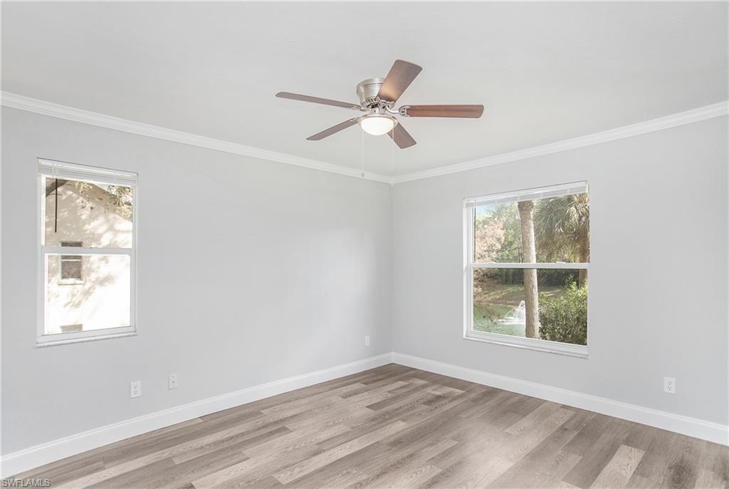 209 Robin Hood Circle, Unit 5201 Naples, FL 34104 - Photo 15 of 30 a view of empty room with window and ceiling fan