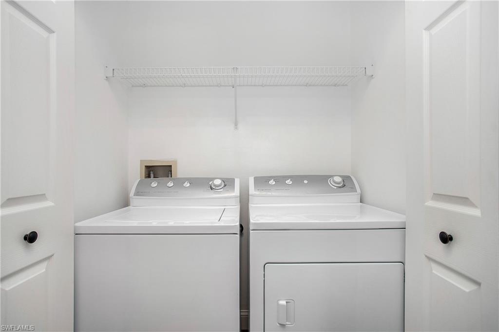 209 Robin Hood Circle, Unit 5201 Naples, FL 34104 - Photo 19 of 30 a utility room with dryer and washer