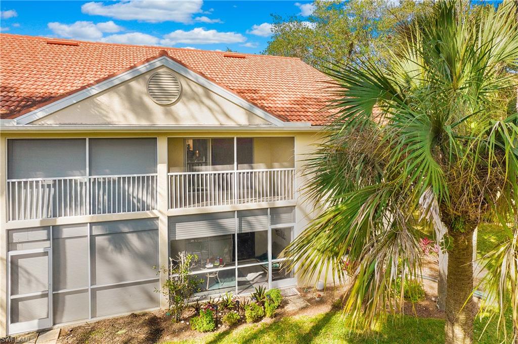209 Robin Hood Circle, Unit 5201 Naples, FL 34104 - Photo 21 of 30 a view of a house with a window