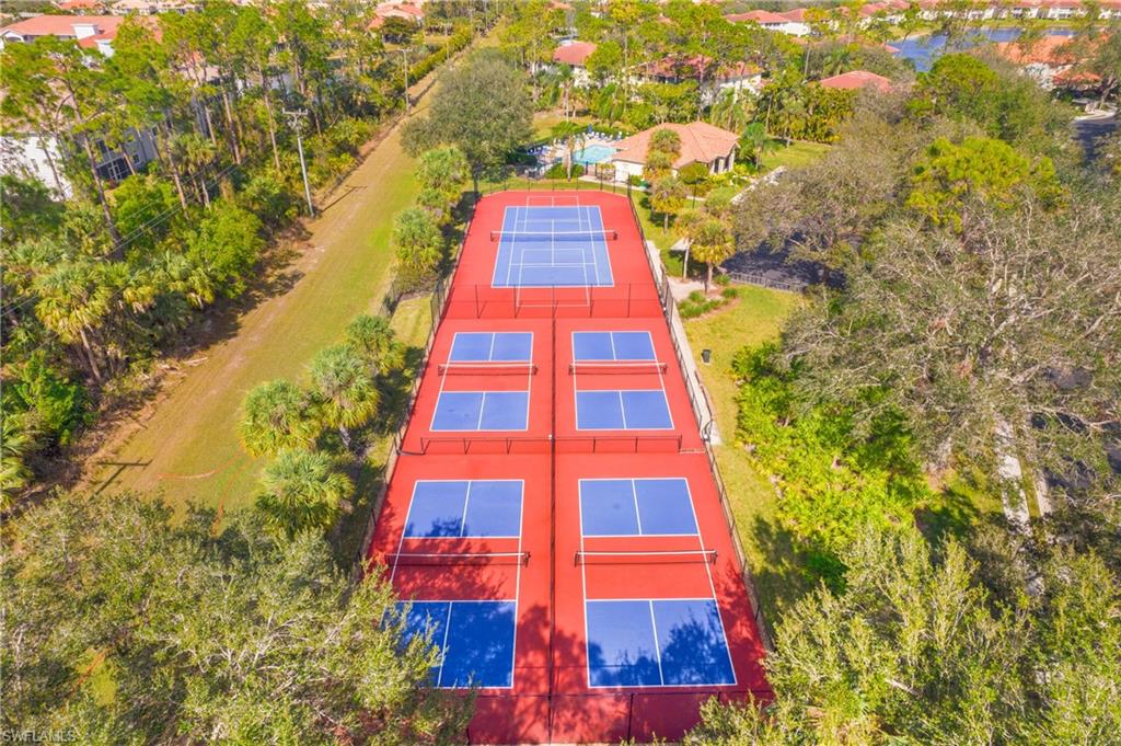 209 Robin Hood Circle, Unit 5201 Naples, FL 34104 - Photo 26 of 30 view of a multi story residential apartment building