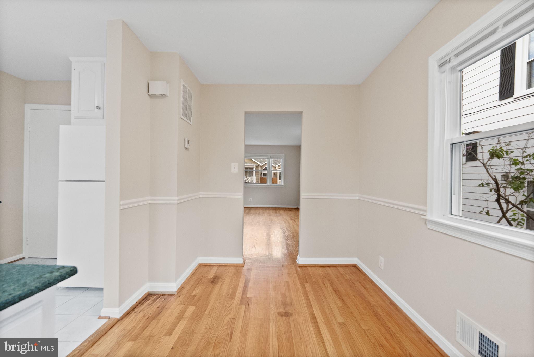 107 East Del Ray Avenue Alexandria, VA 22301 - Photo 15 of 30 a view of empty room with wooden floor and fan