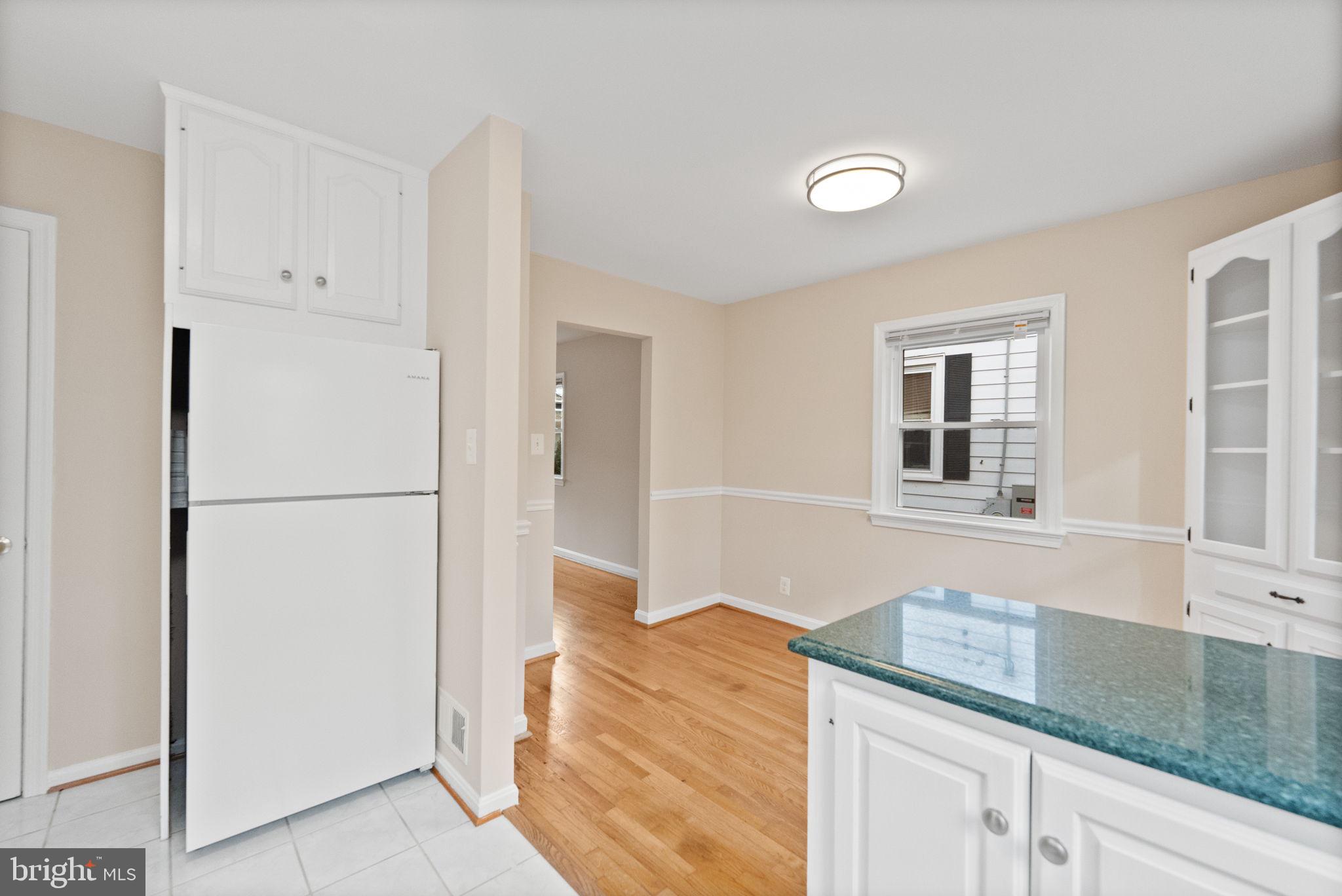 107 East Del Ray Avenue Alexandria, VA 22301 - Photo 16 of 30 a kitchen with granite countertop a refrigerator and a sink