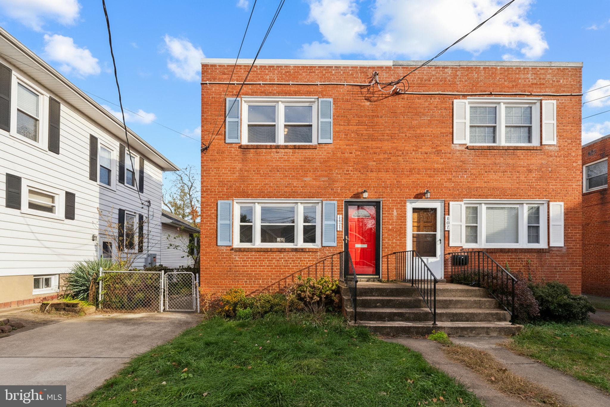 107 East Del Ray Avenue Alexandria, VA 22301 - Photo 2 of 30 a front view of a house with a yard