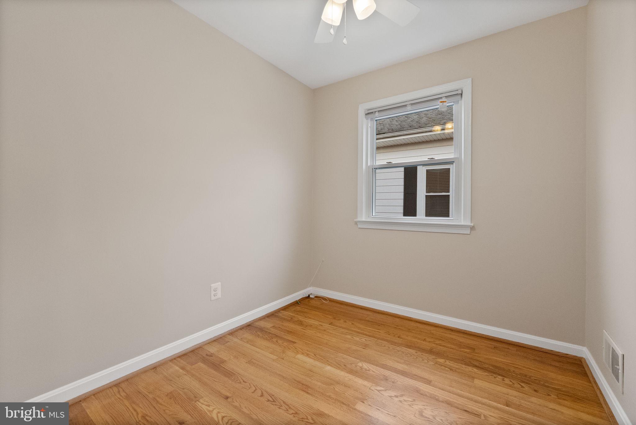 107 East Del Ray Avenue Alexandria, VA 22301 - Photo 21 of 30 a view of empty room with wooden floor