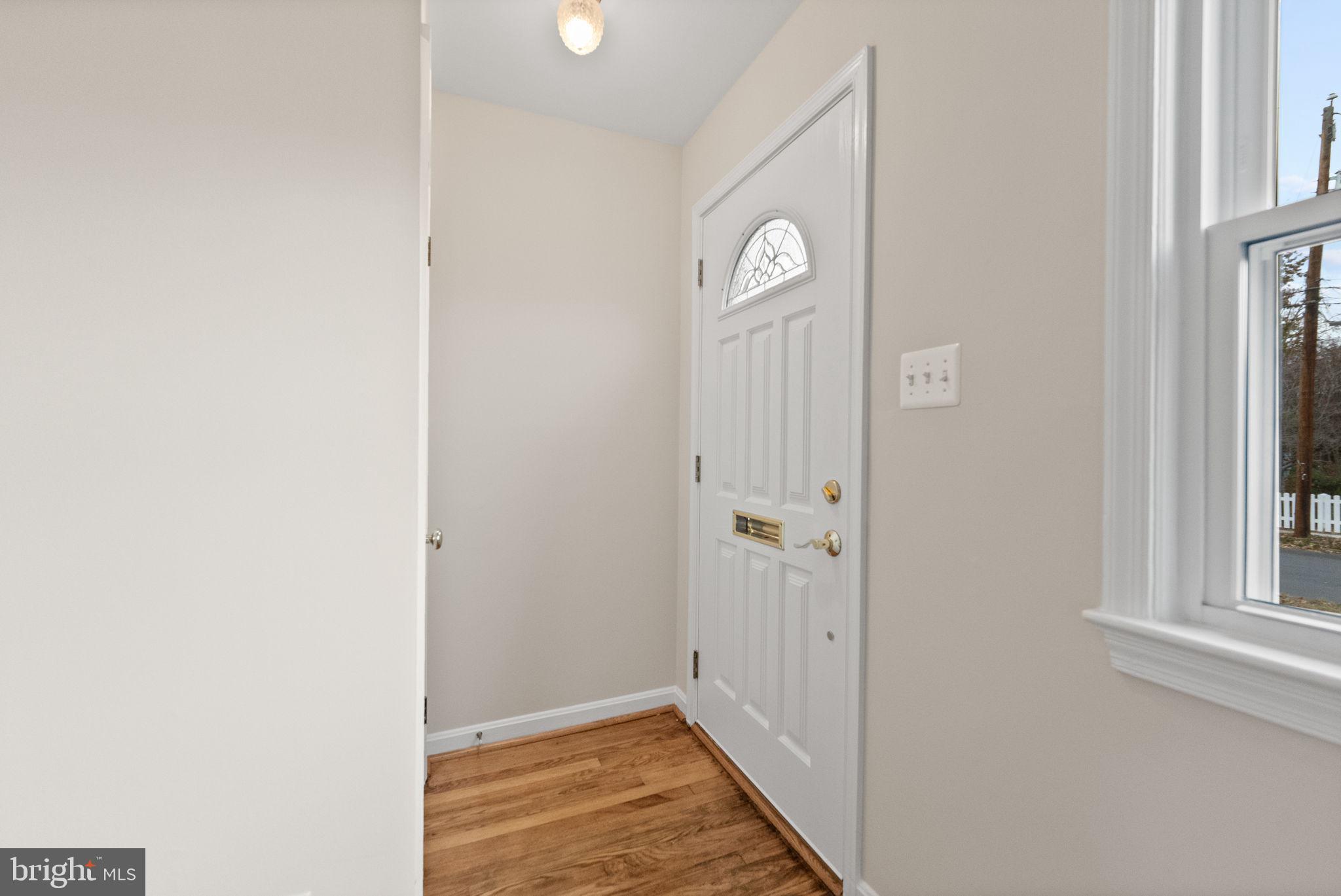 107 East Del Ray Avenue Alexandria, VA 22301 - Photo 25 of 30 a view of a livingroom with wooden floor