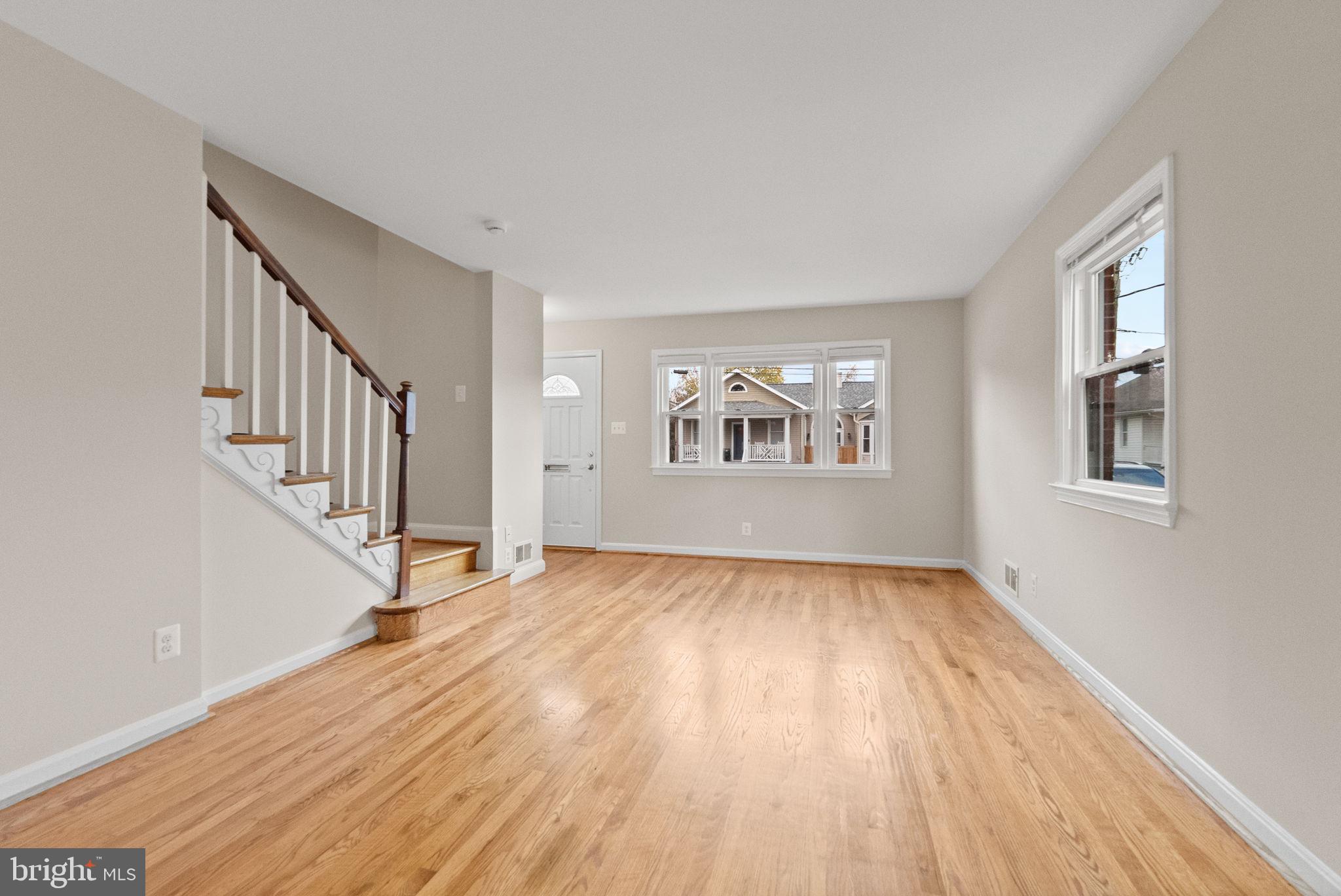 107 East Del Ray Avenue Alexandria, VA 22301 - Photo 26 of 30 a view of an empty room with wooden floor and a window