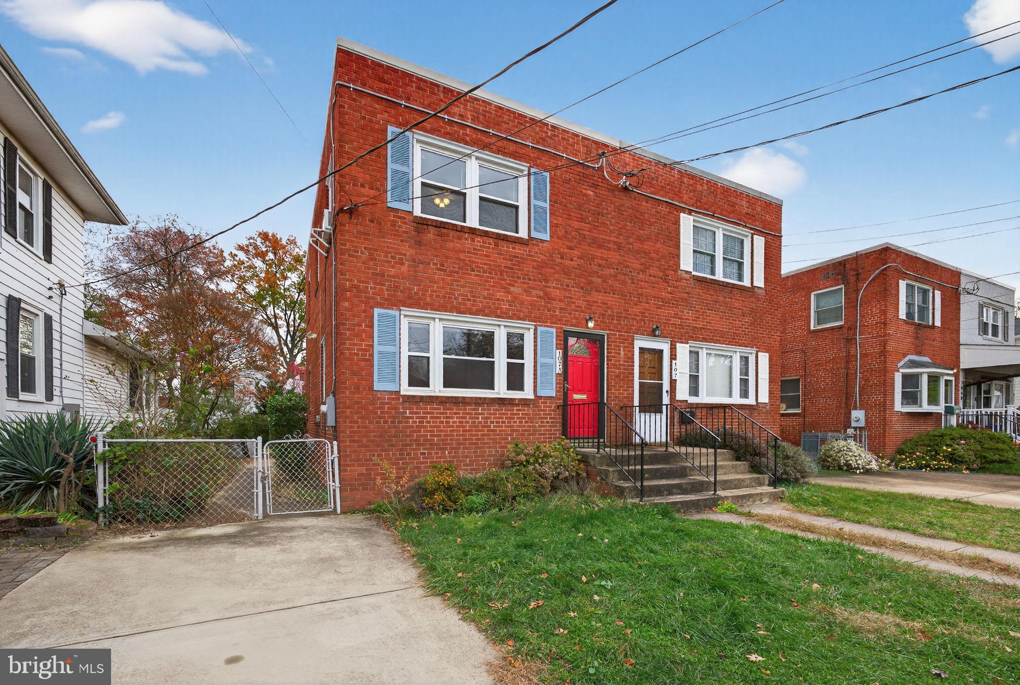 107 East Del Ray Avenue Alexandria, VA 22301 - Photo 29 of 30 a front view of a house with a yard