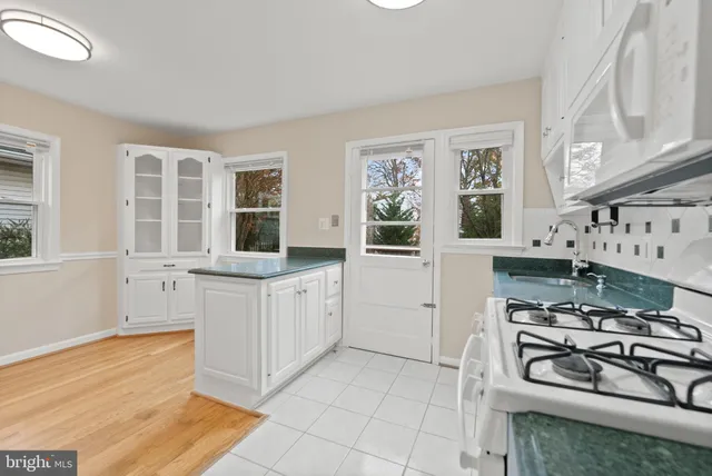 a kitchen with stainless steel appliances a stove and a refrigerator