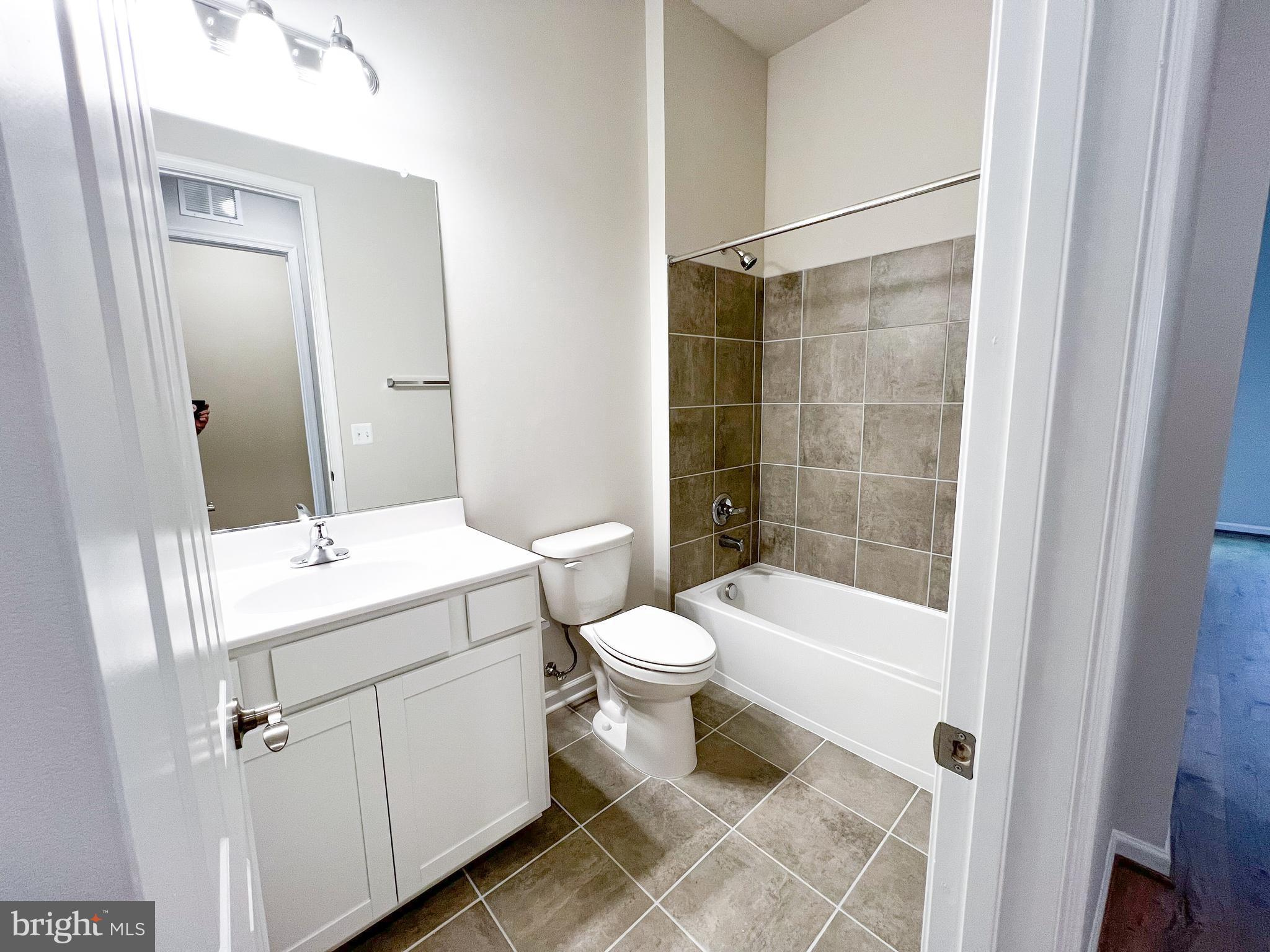 9204 Crestview Rdg Drive Bristow, VA 20136 - Photo 12 of 30 a bathroom with a sink a toilet and shower