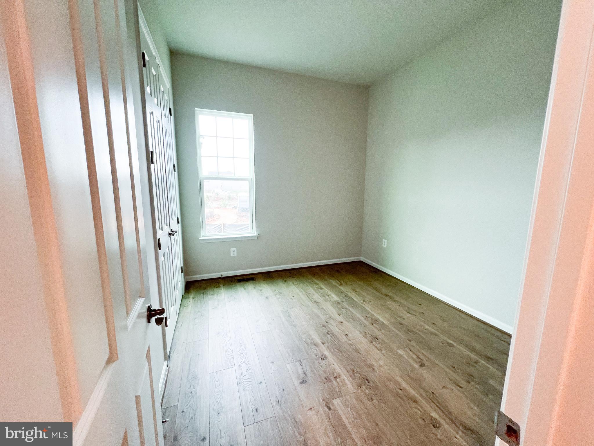 9204 Crestview Rdg Drive Bristow, VA 20136 - Photo 13 of 30 an empty room with wooden floor and window
