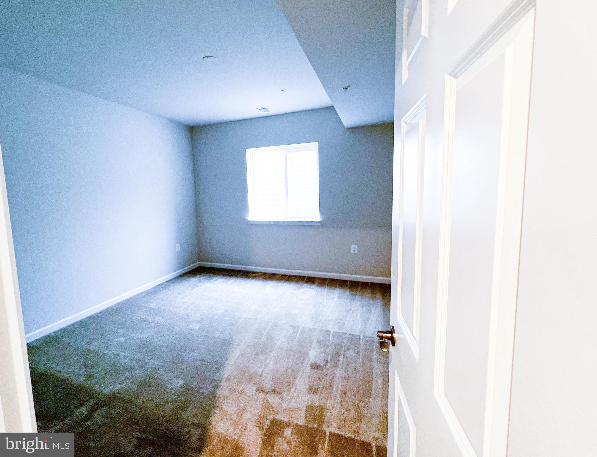 9204 Crestview Rdg Drive Bristow, VA 20136 - Photo 16 of 30 an empty room with wooden floor and windows