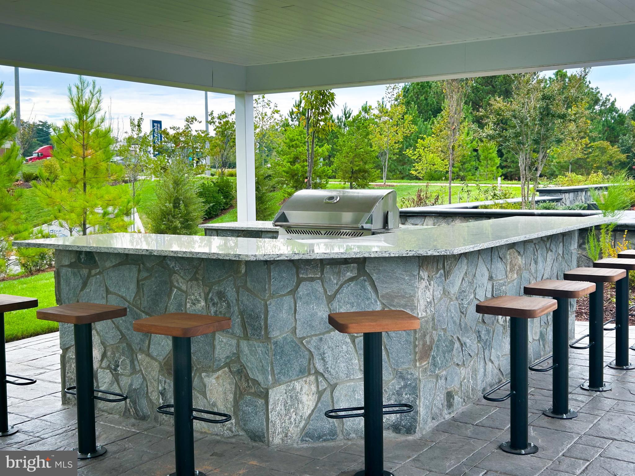 9204 Crestview Rdg Drive Bristow, VA 20136 - Photo 20 of 30 a kitchen with a table and chairs in it