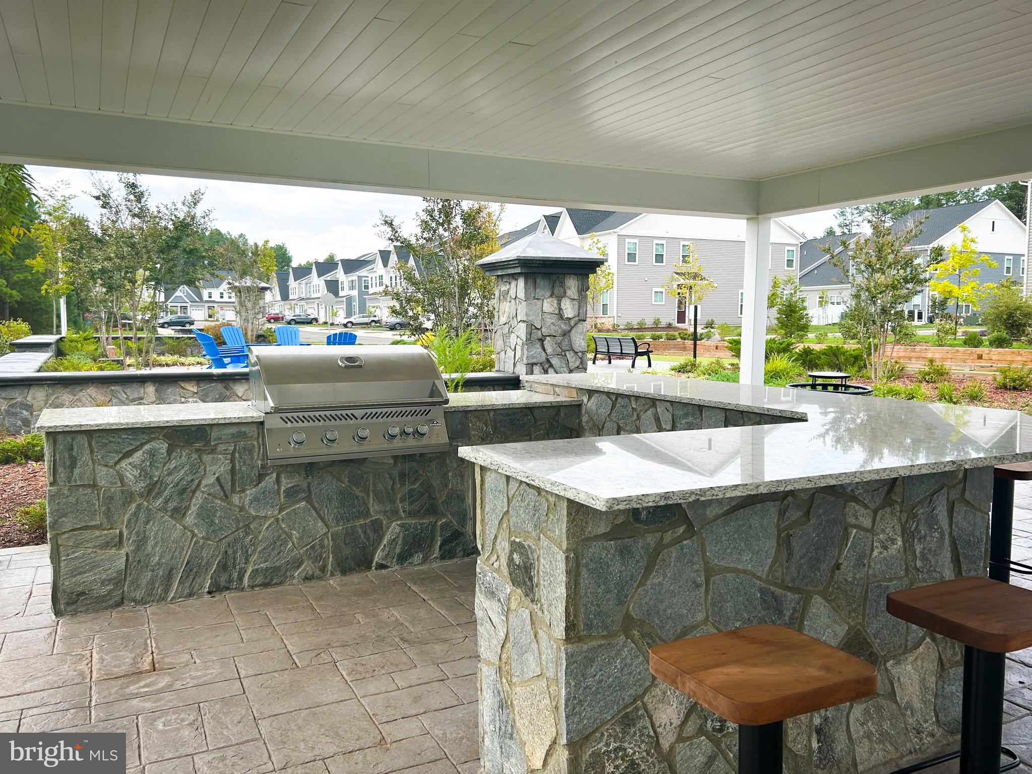 9204 Crestview Rdg Drive Bristow, VA 20136 - Photo 21 of 30 a kitchen with stainless steel appliances granite countertop a sink and a counter