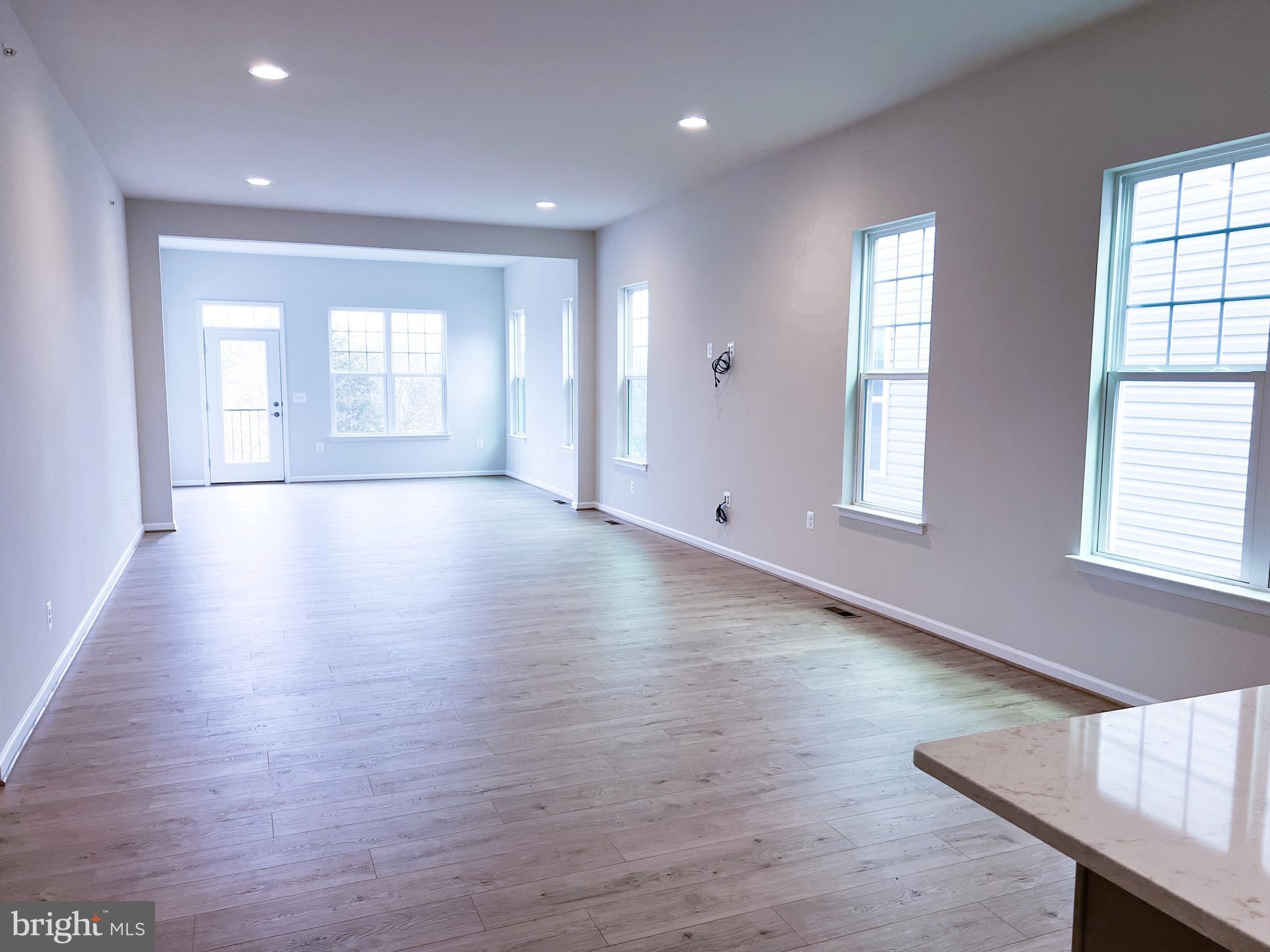 9204 Crestview Rdg Drive Bristow, VA 20136 - Photo 3 of 30 an empty room with wooden floor and windows