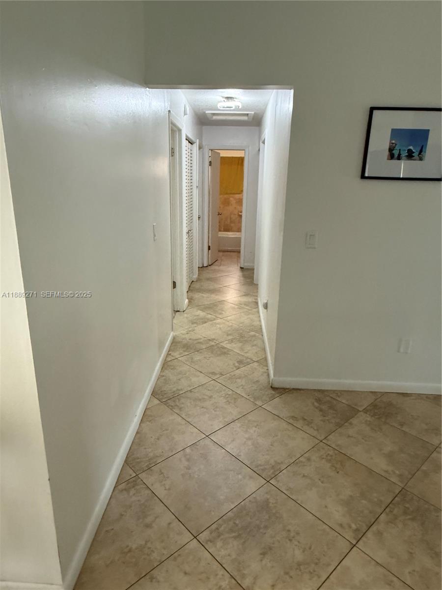 13060 Southwest 263rd Terrace Homestead, FL 33032 - Photo 12 of 30 a view of a hallway