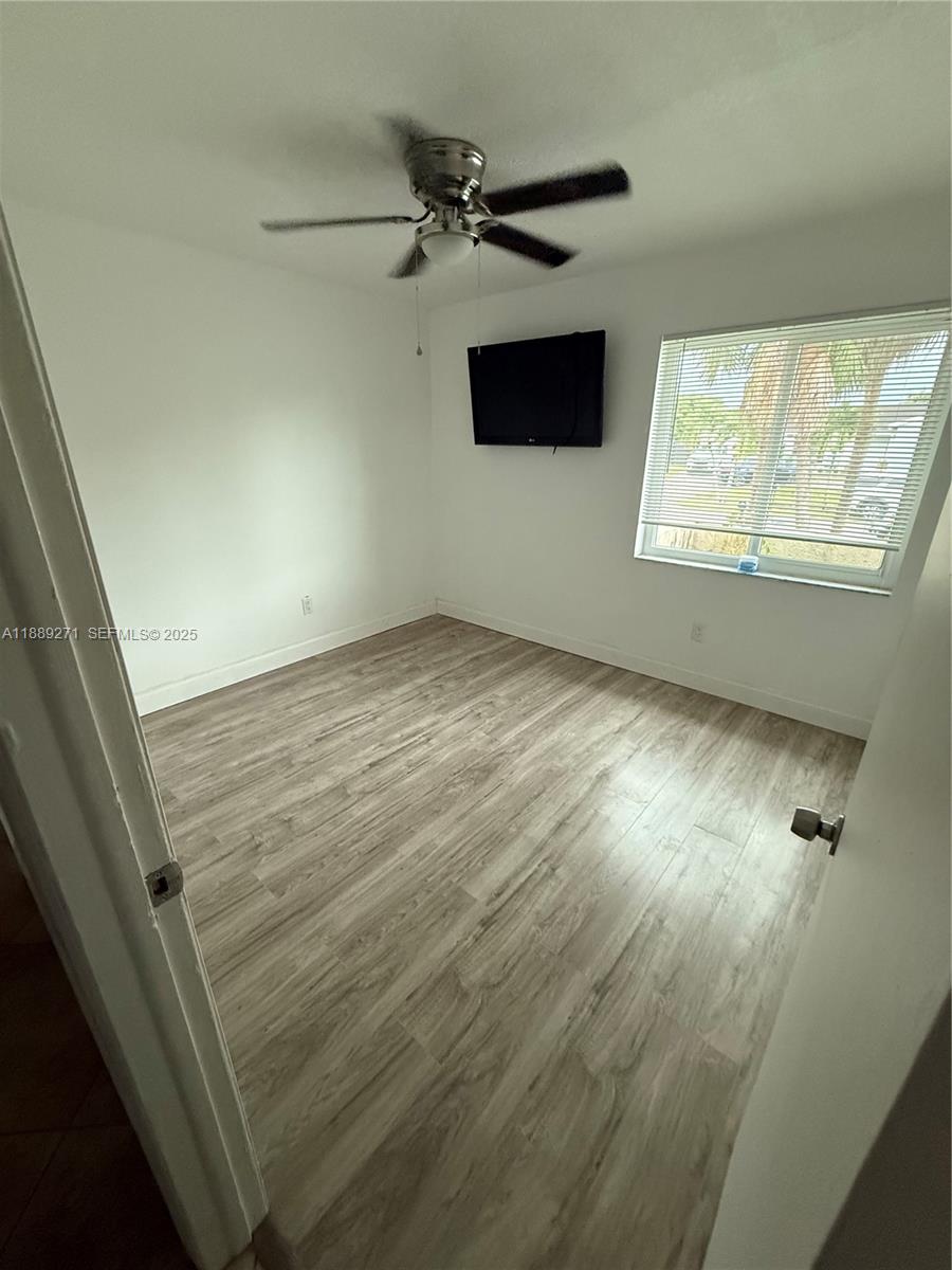 13060 Southwest 263rd Terrace Homestead, FL 33032 - Photo 14 of 30 a view of an empty room with a window