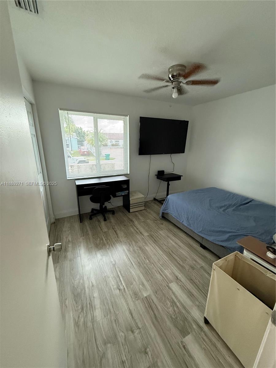 13060 Southwest 263rd Terrace Homestead, FL 33032 - Photo 15 of 30 a living room with furniture and a flat screen tv
