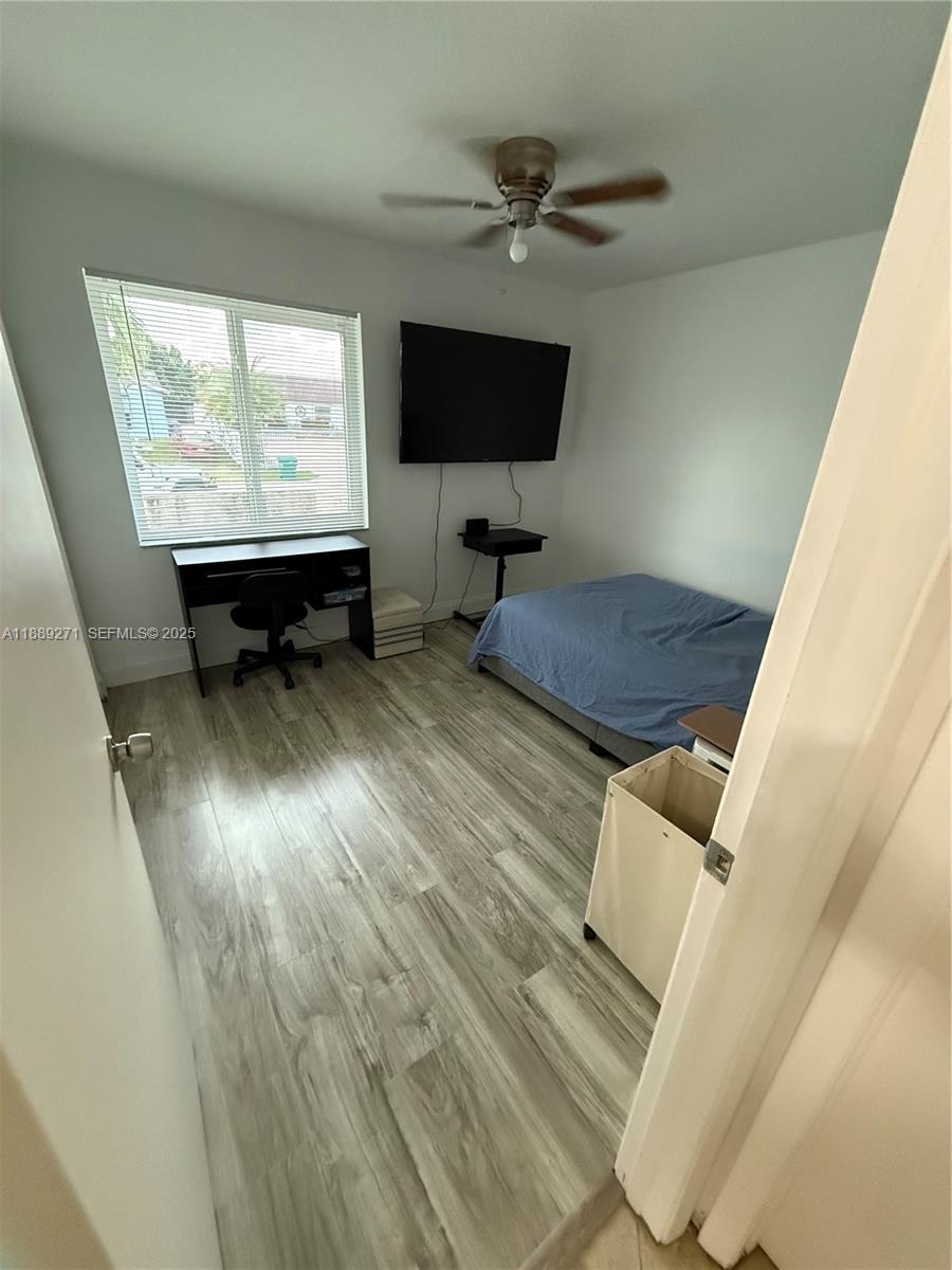 13060 Southwest 263rd Terrace Homestead, FL 33032 - Photo 17 of 30 a living room with furniture and a flat screen tv