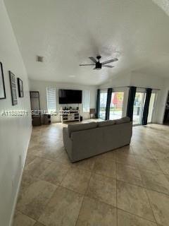 13060 Southwest 263rd Terrace Homestead, FL 33032 - Photo 29 of 30 a living room with furniture and a flat screen tv