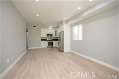 a kitchen with a refrigerator stove and microwave