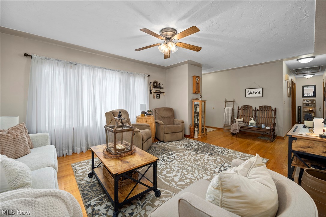965 Gulf Road Elyria, OH 44035 - Photo 3 of 37 Living room featuring light hardwood flooring and ceiling fan