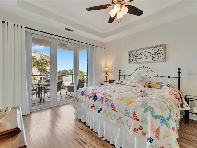 a bedroom with beds and a large window