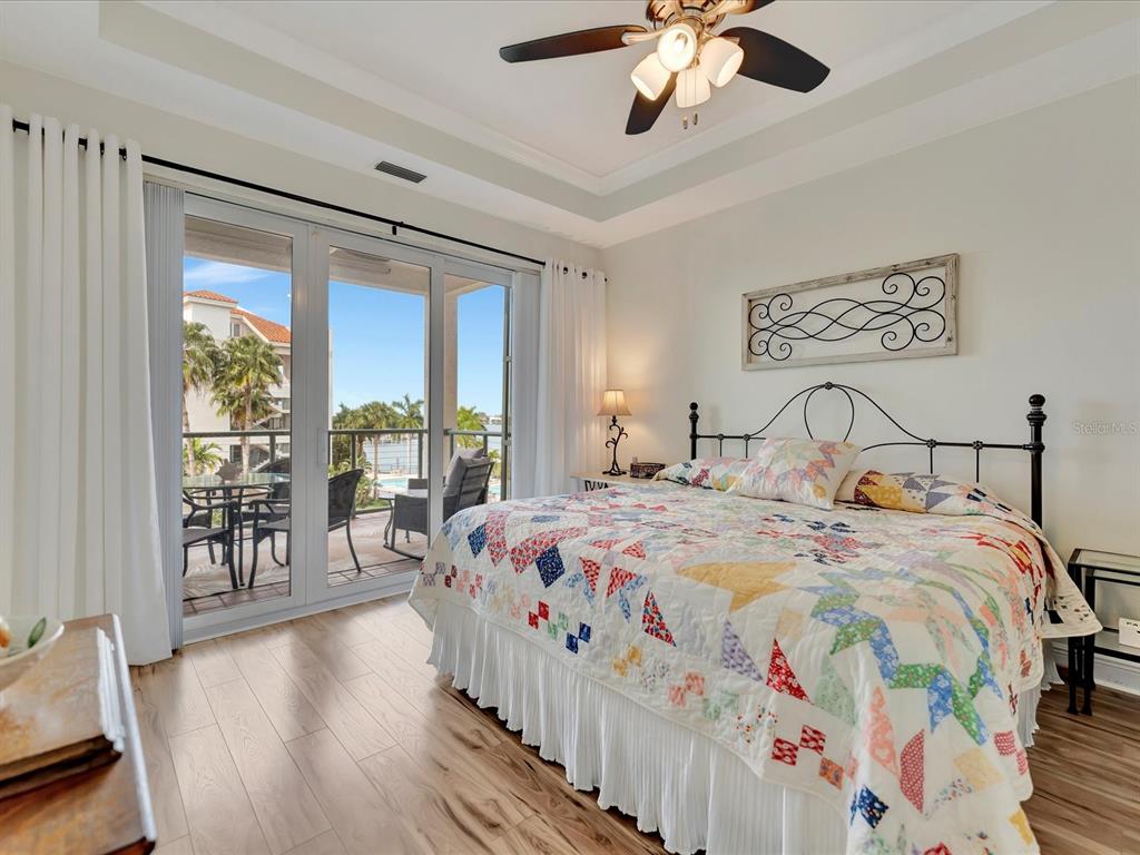 1022 Bellasol Way, Unit 5302 Apollo Beach, FL 33572 - Photo 20 of 43 a bedroom with beds and a large window