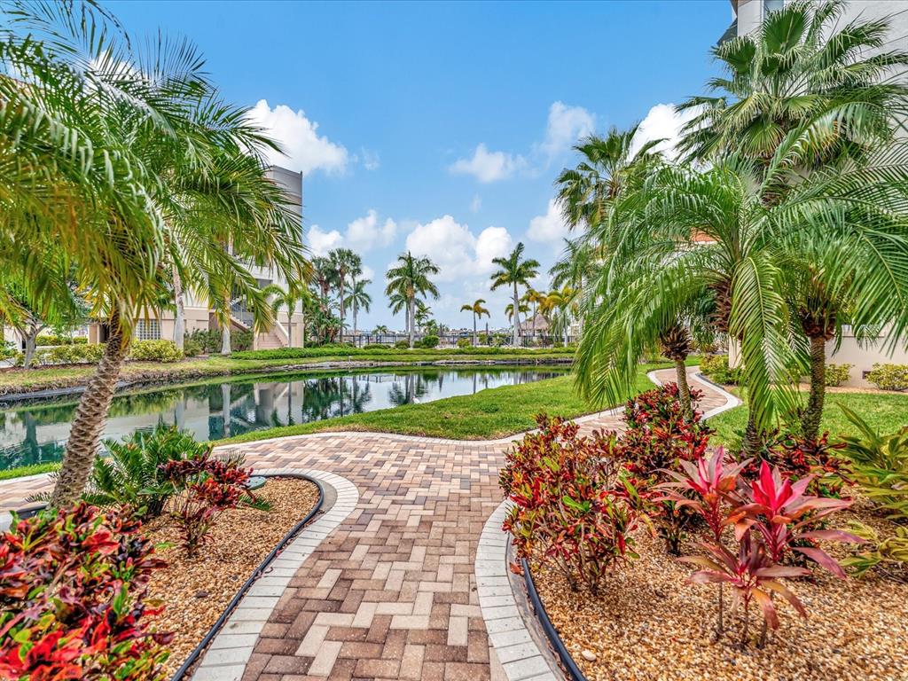 1022 Bellasol Way, Unit 5302 Apollo Beach, FL 33572 - Photo 27 of 43 a view of a pathway with a garden