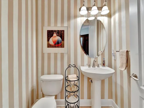 a bathroom with a sink vanity and a mirror