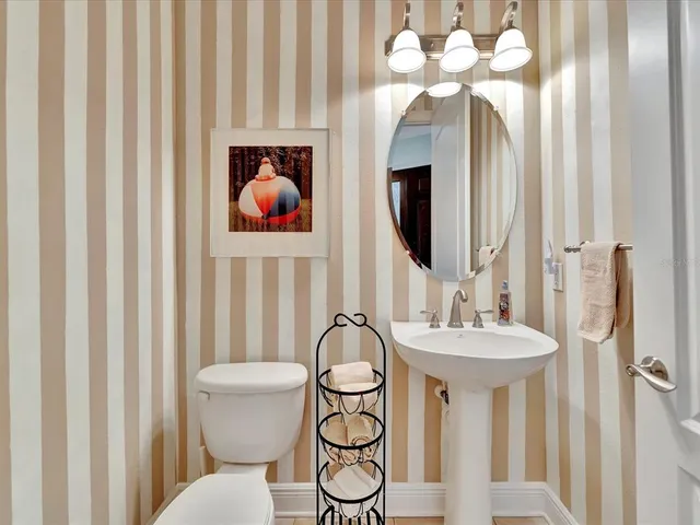 a bathroom with a sink vanity and a mirror