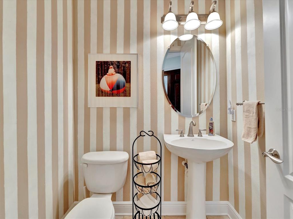 1022 Bellasol Way, Unit 5302 Apollo Beach, FL 33572 - Photo 7 of 43 a bathroom with a sink vanity and a mirror