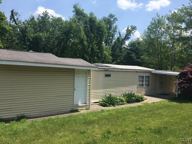 643 Slateford Road Mount Bethel, PA 18343 - Photo 3 of 15 a view of a backyard with plants and large tree