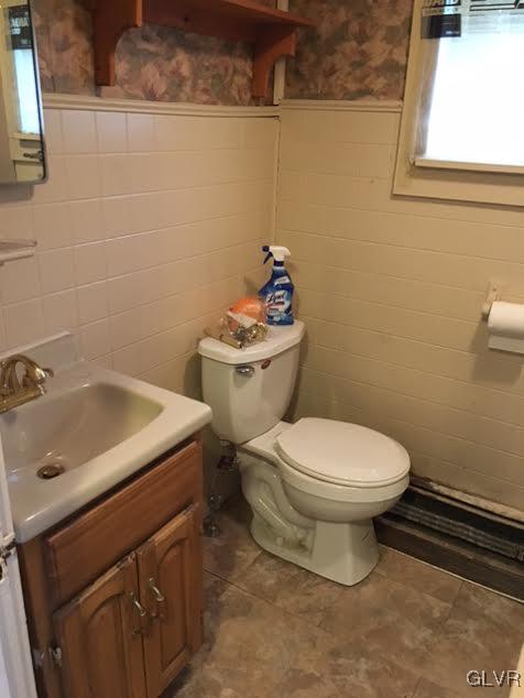 643 Slateford Road Mount Bethel, PA 18343 - Photo 7 of 15 a white toilet sitting next to a bathroom sink