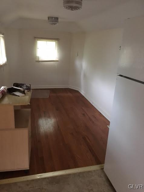 643 Slateford Road Mount Bethel, PA 18343 - Photo 8 of 15 an empty room with wooden floor cabinet and windows