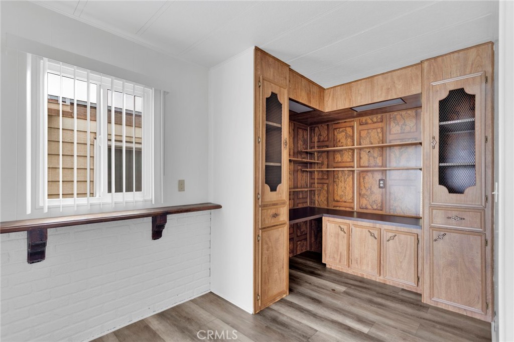 15252 Seneca Road, Unit 241 Victorville, CA 92392 - Photo 15 of 30 a view of an empty room with cabinet and a window