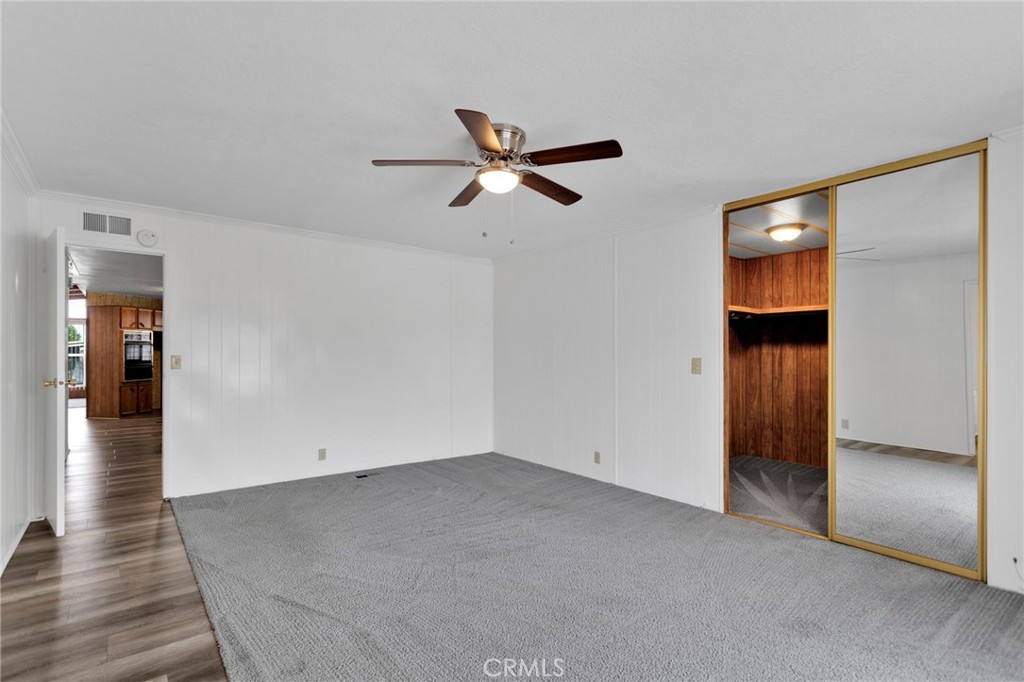 15252 Seneca Road, Unit 241 Victorville, CA 92392 - Photo 16 of 30 wooden floor in an empty room with a window