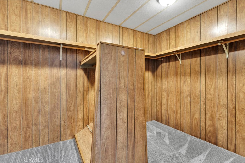 15252 Seneca Road, Unit 241 Victorville, CA 92392 - Photo 17 of 30 a view of walk in closet with wooden fence