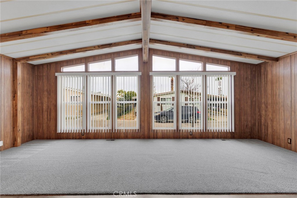 15252 Seneca Road, Unit 241 Victorville, CA 92392 - Photo 8 of 30 a view of an empty room with a balcony