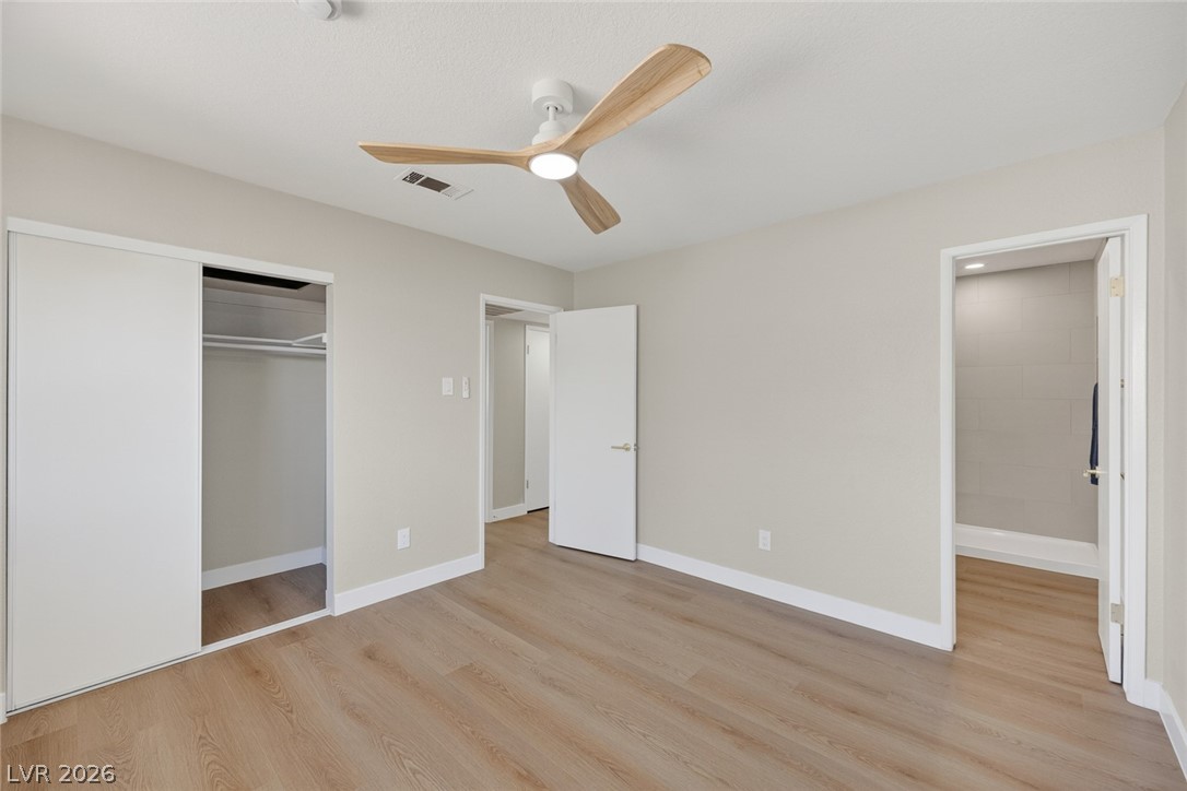 2484 Anglia Street Las Vegas, NV 89142 - Photo 10 of 20 This bright room features a ceiling fan, closet, and durable flooring for comfortable living.