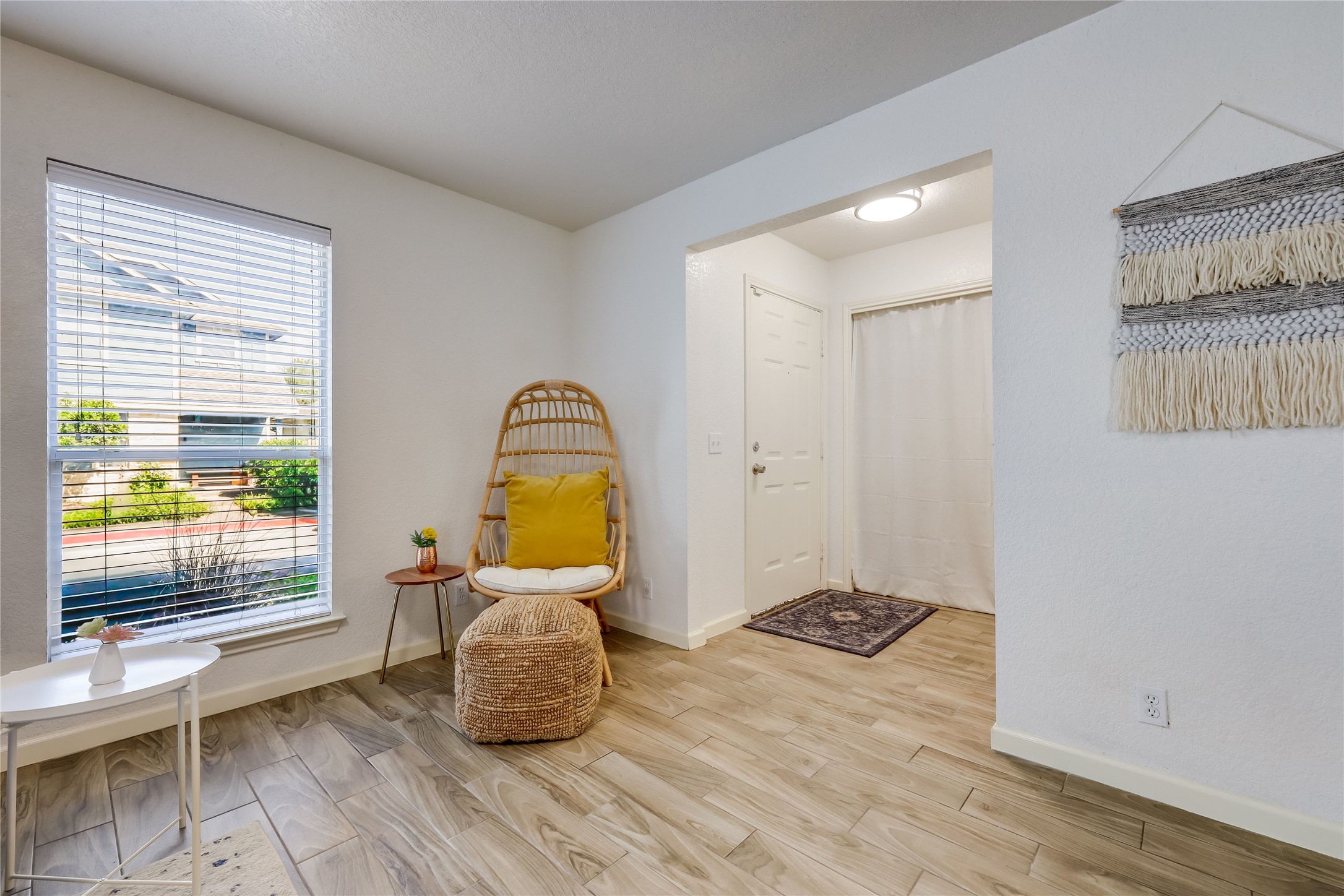 4510 Secure Lane Austin, TX 78725 - Photo 18 of 24 a bedroom with a bed and wooden floor