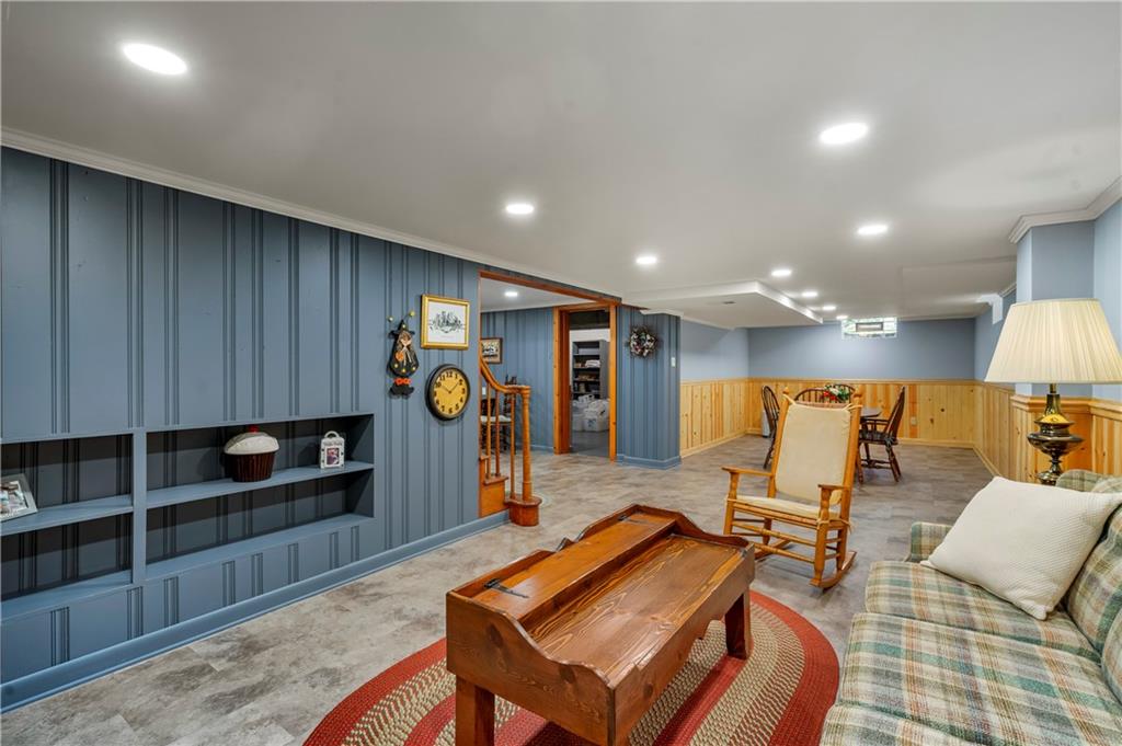 801 Spring Street Latrobe, PA 15650 - Photo 21 of 25 a living room with furniture a lamp and a view of kitchen