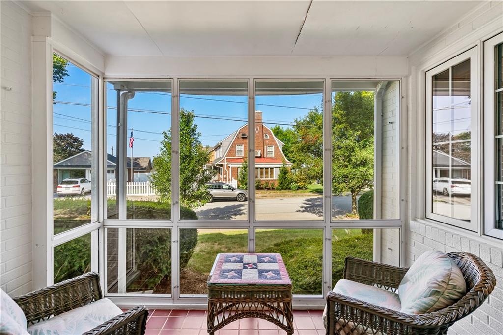 801 Spring Street Latrobe, PA 15650 - Photo 7 of 25 a living room with patio chairs and a floor to ceiling window
