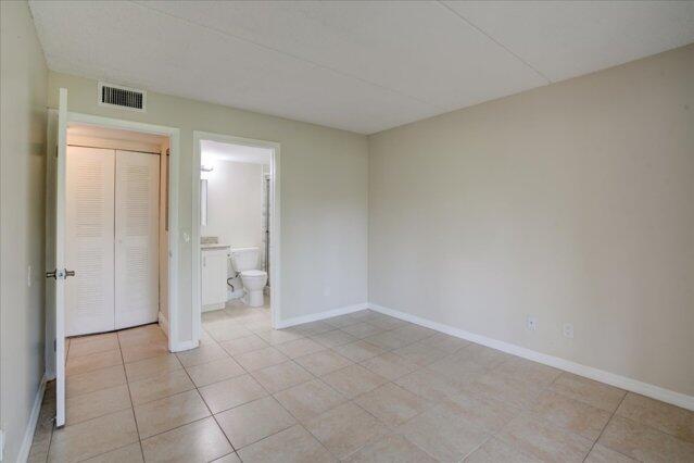 1104 Meadows Circle, Unit 1104 Boynton Beach, FL 33436 - Photo 22 of 27 a view of a room with white doors