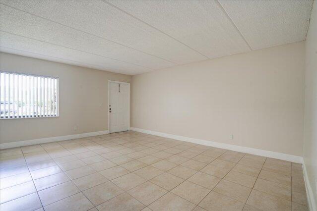 1104 Meadows Circle, Unit 1104 Boynton Beach, FL 33436 - Photo 4 of 27 an empty room with windows